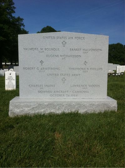 Group marker, Arlington National Cemetery, Section 60, Grave 10595. Five airmen of the United States Air Force and two soldiers of the United States Army died together in a downed aircraft over Cambodia on 24 October 1964 and were buried together beneath one stone carrying all seven names. Front face, carrying the names.