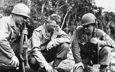 BG Frank D. Merrill (center) explains battle situation to L. Herb Miyazaki and R. Akiji Yoshimura, interpreters for 3rd Battalion 5307th, Burma, 1944.